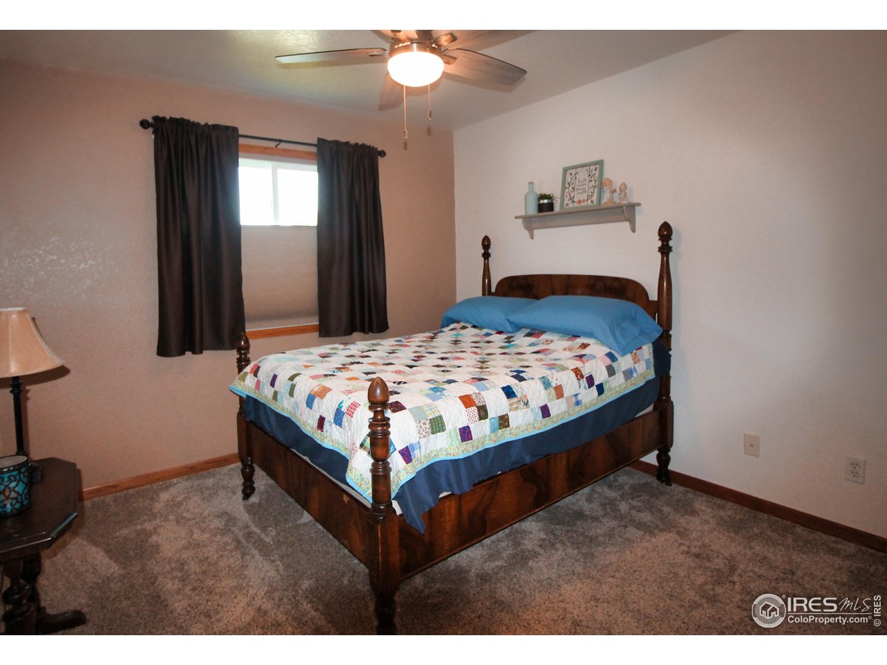 14363 Dakota Road Sterling, CO 80751 - Photo 15 of 40 a bedroom with a bed window and dresser