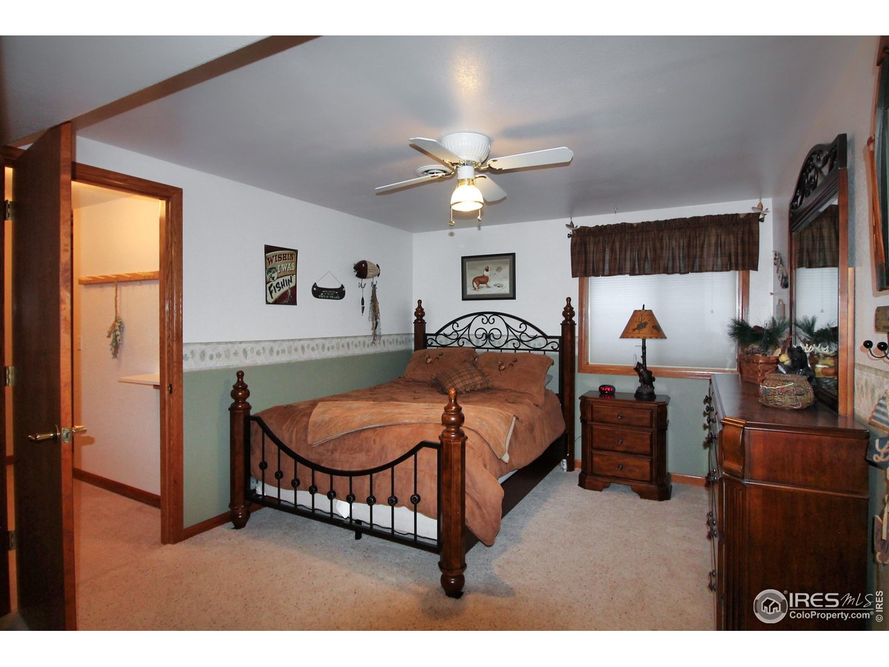14363 Dakota Road Sterling, CO 80751 - Photo 24 of 40 a bedroom with a bed window and a ceiling fan