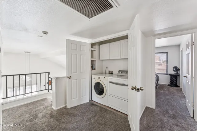 a view of a storage & utility room with washer and dryer