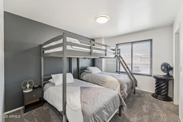 a bed room with a bed and a window