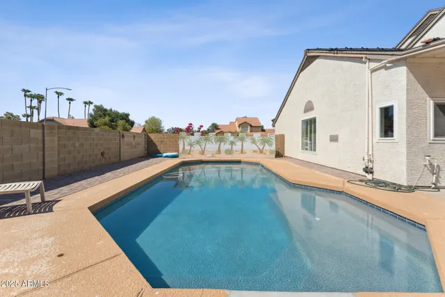a view of a swimming pool with a chair
