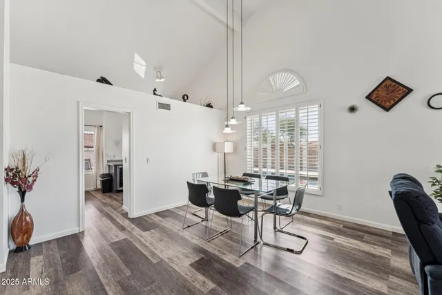 a view of a livingroom with furniture and wooden floor