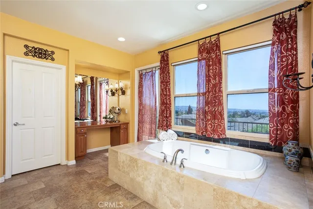 a bedroom with a bed dresser and a window