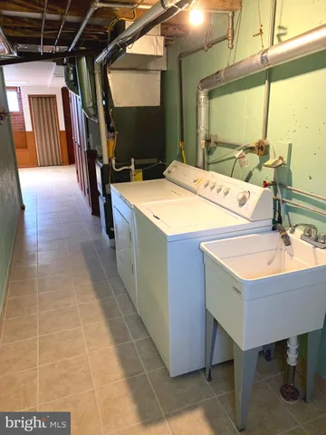 a utility room with washer and dryer