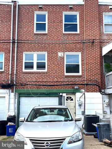 a front view of a building with glass windows