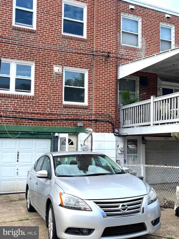 a car parked in front of a building