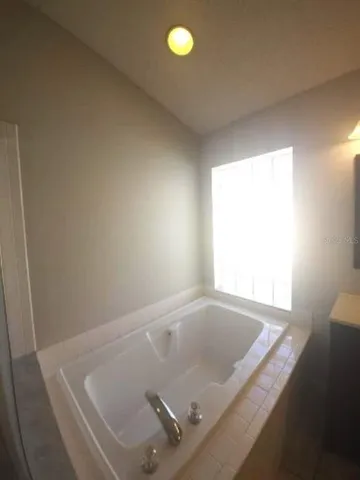 a bathroom with a sink a vanity and mirror