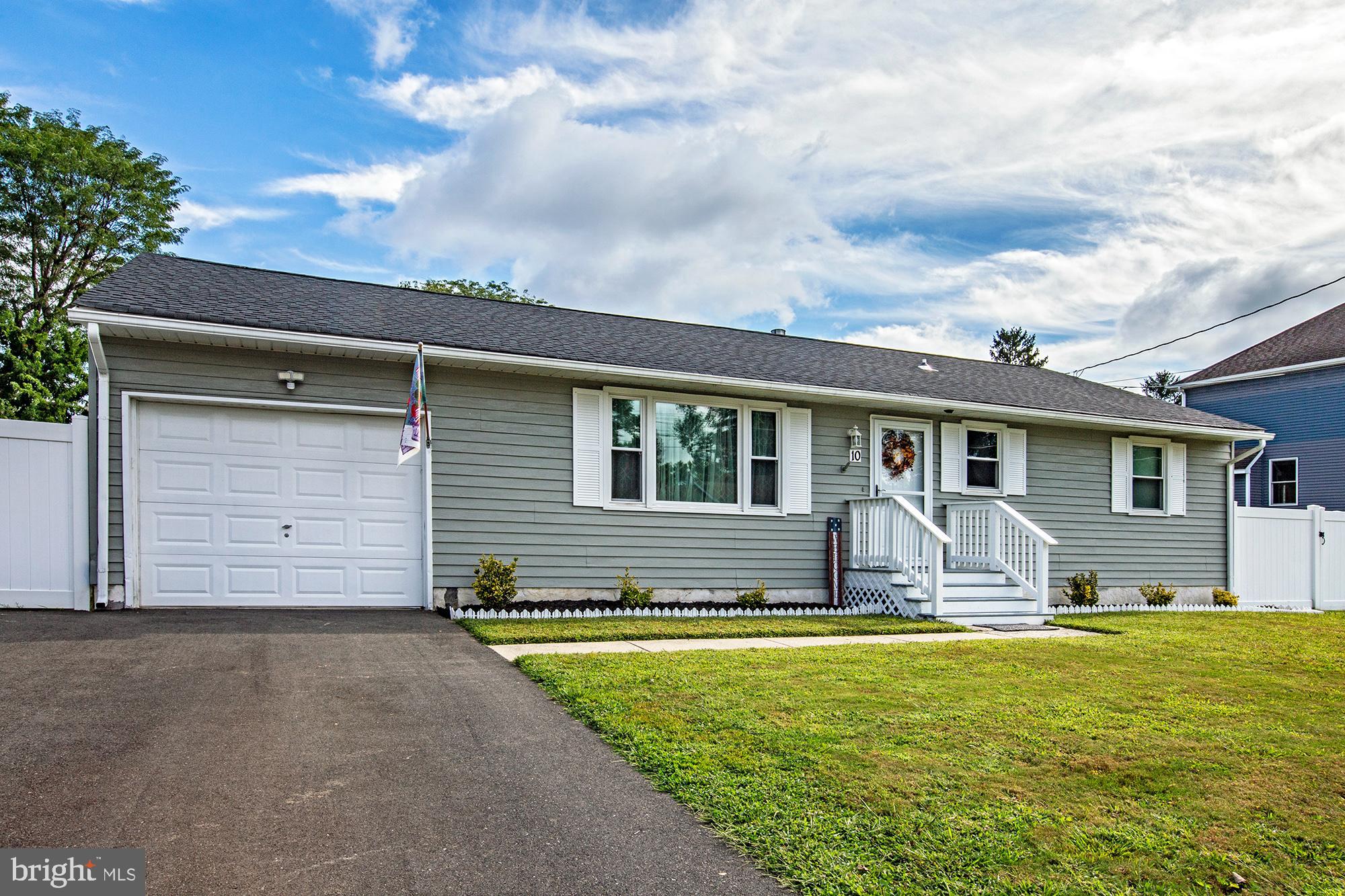 10 Lafayette Road Pennsville, NJ 08070 - Photo 1 of 22 a front view of house with yard outdoor seating and barbeque oven