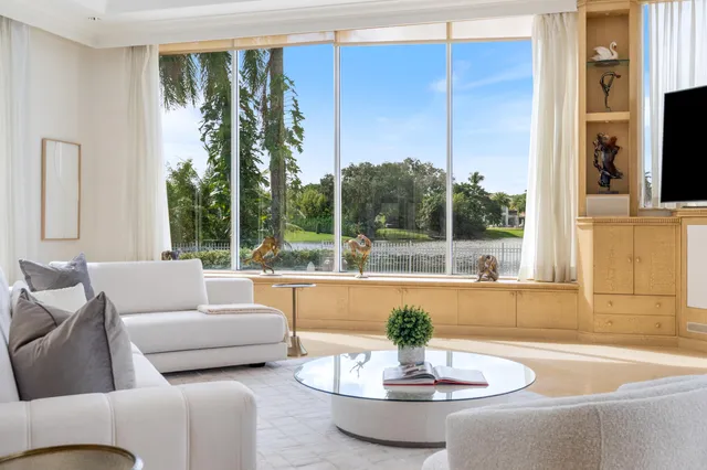 a view of a garden with lawn chairs and a yard