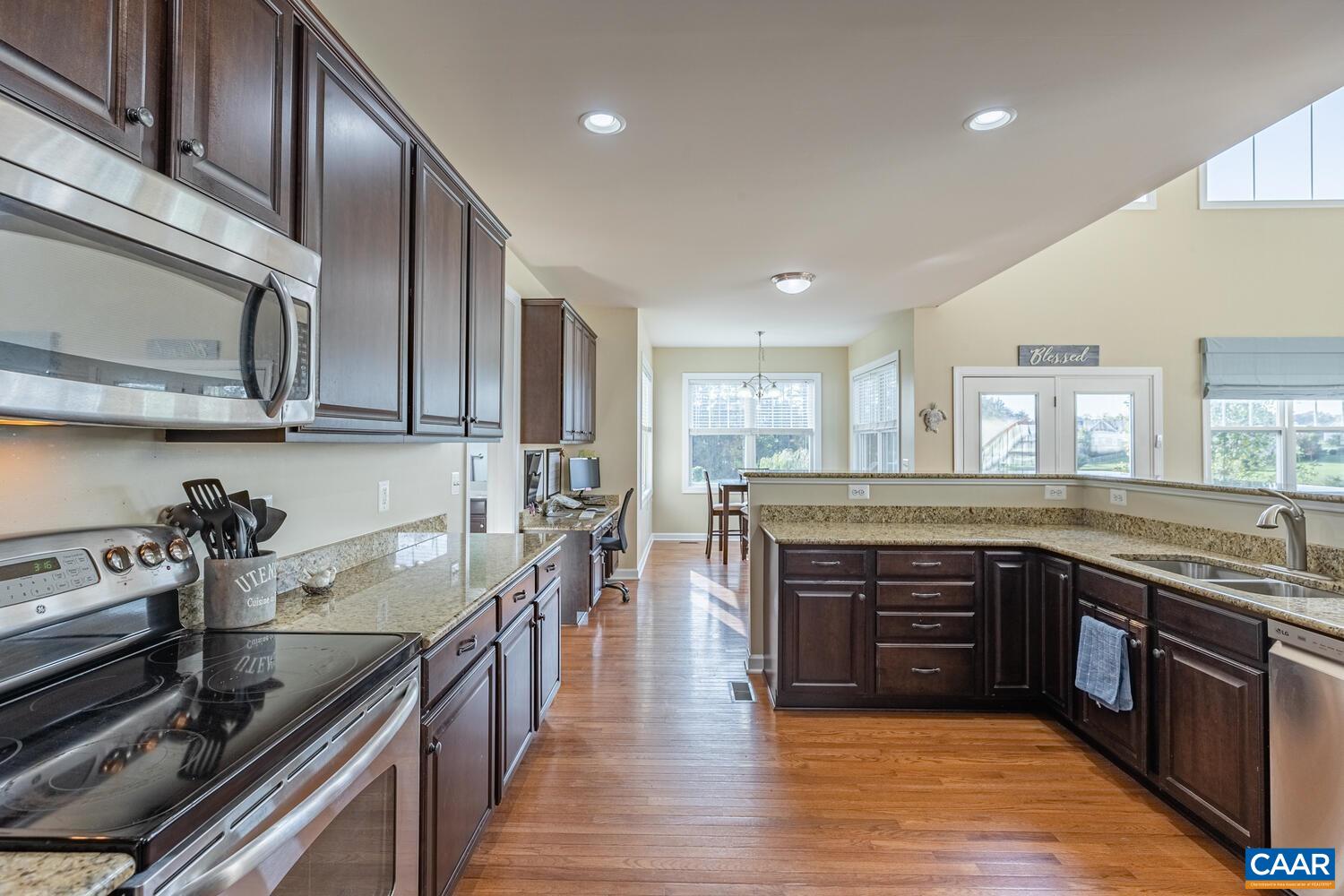 97 Wexford Ridge Road Ruckersville, VA 22968 - Photo 11 of 70 a kitchen with stainless steel appliances granite countertop a stove and a sink