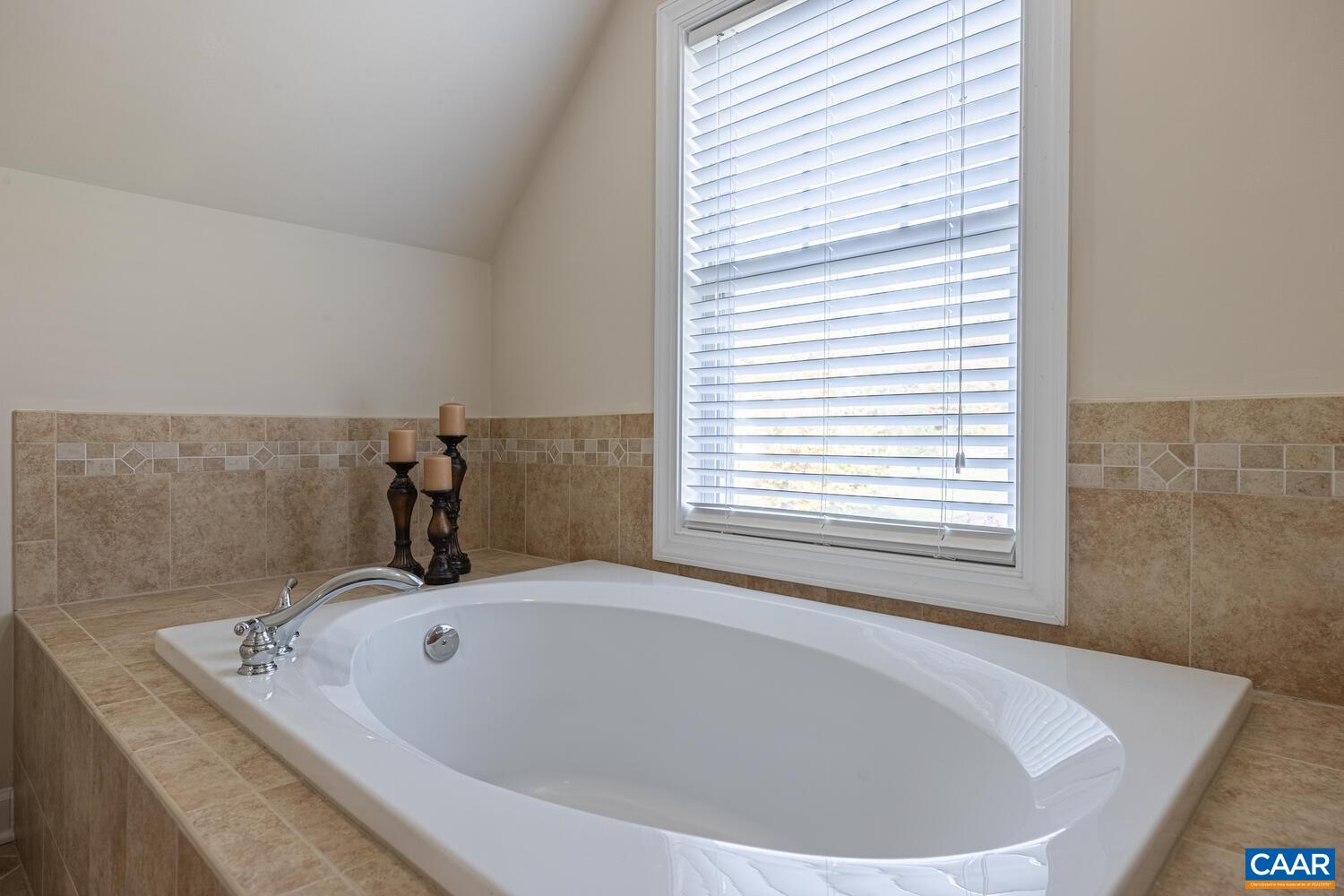 97 Wexford Ridge Road Ruckersville, VA 22968 - Photo 38 of 70 a bath tub sitting in a bathroom next to a window