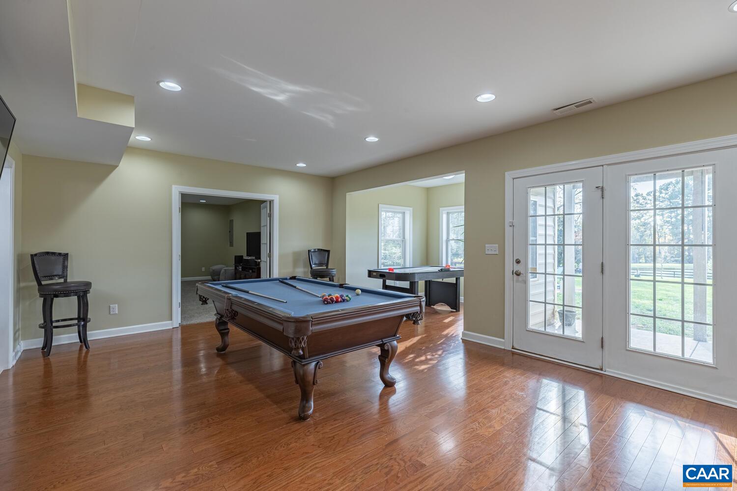 97 Wexford Ridge Road Ruckersville, VA 22968 - Photo 39 of 70 a room with furniture pool table wooden floor and windows
