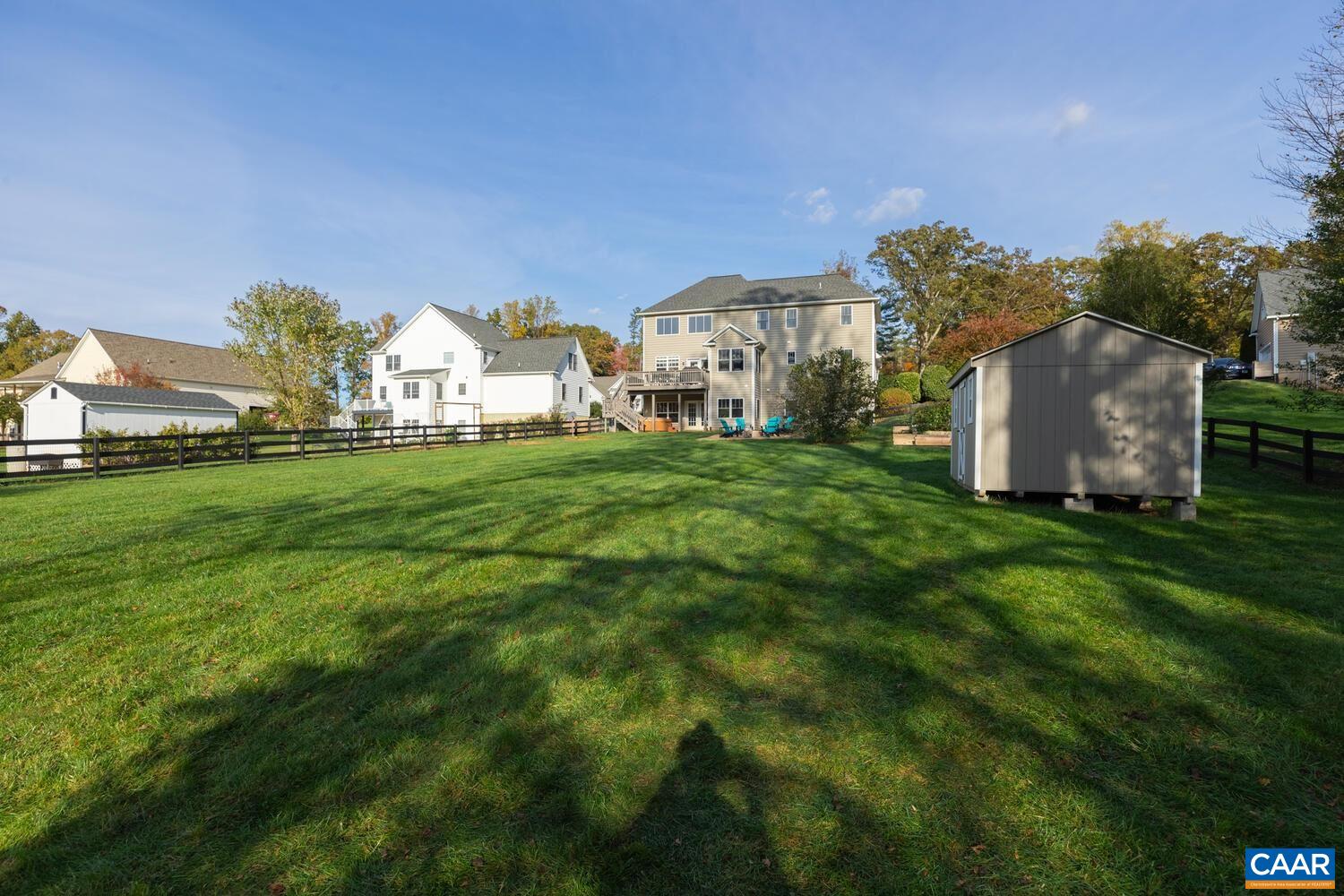 97 Wexford Ridge Road Ruckersville, VA 22968 - Photo 60 of 70 a view of a big house with a big yard and large trees