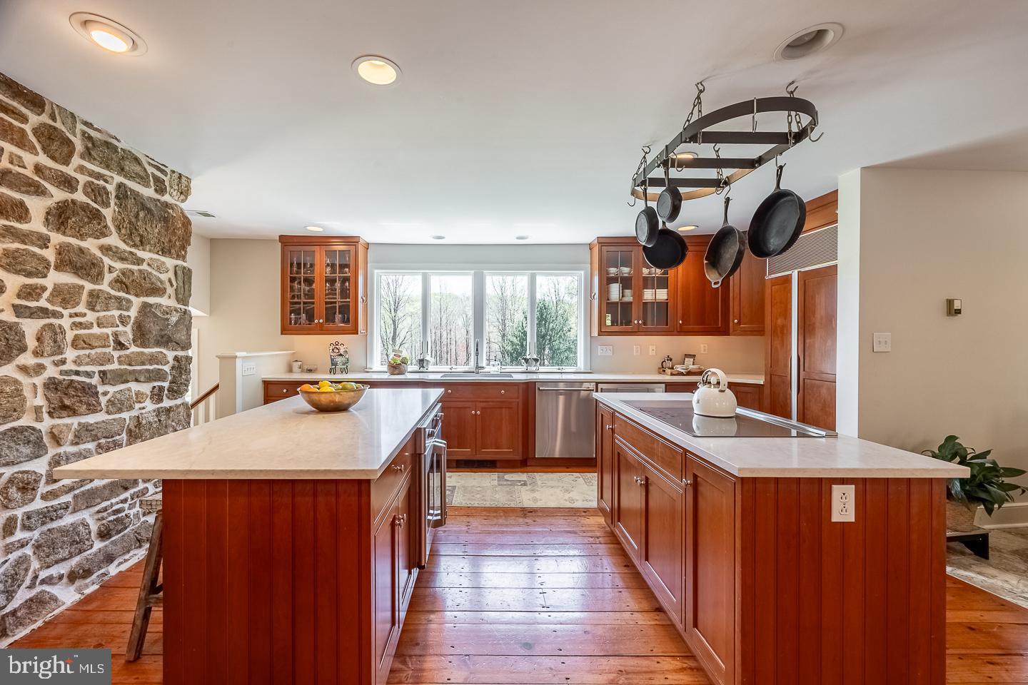 1640 Sheeder Mill Spring City, PA 19475 - Photo 8 of 63 a kitchen with stainless steel appliances granite countertop a sink and a stove
