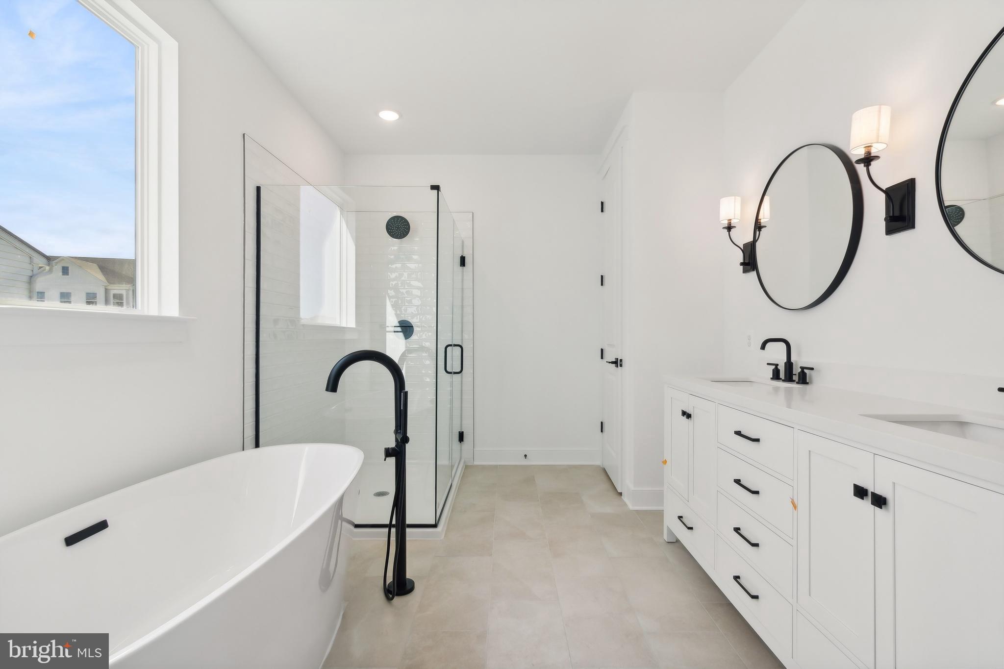 36435 Maple Ridge Lane Georgetown, DE 19947 - Photo 13 of 38 a bathroom with a tub sink and mirror
