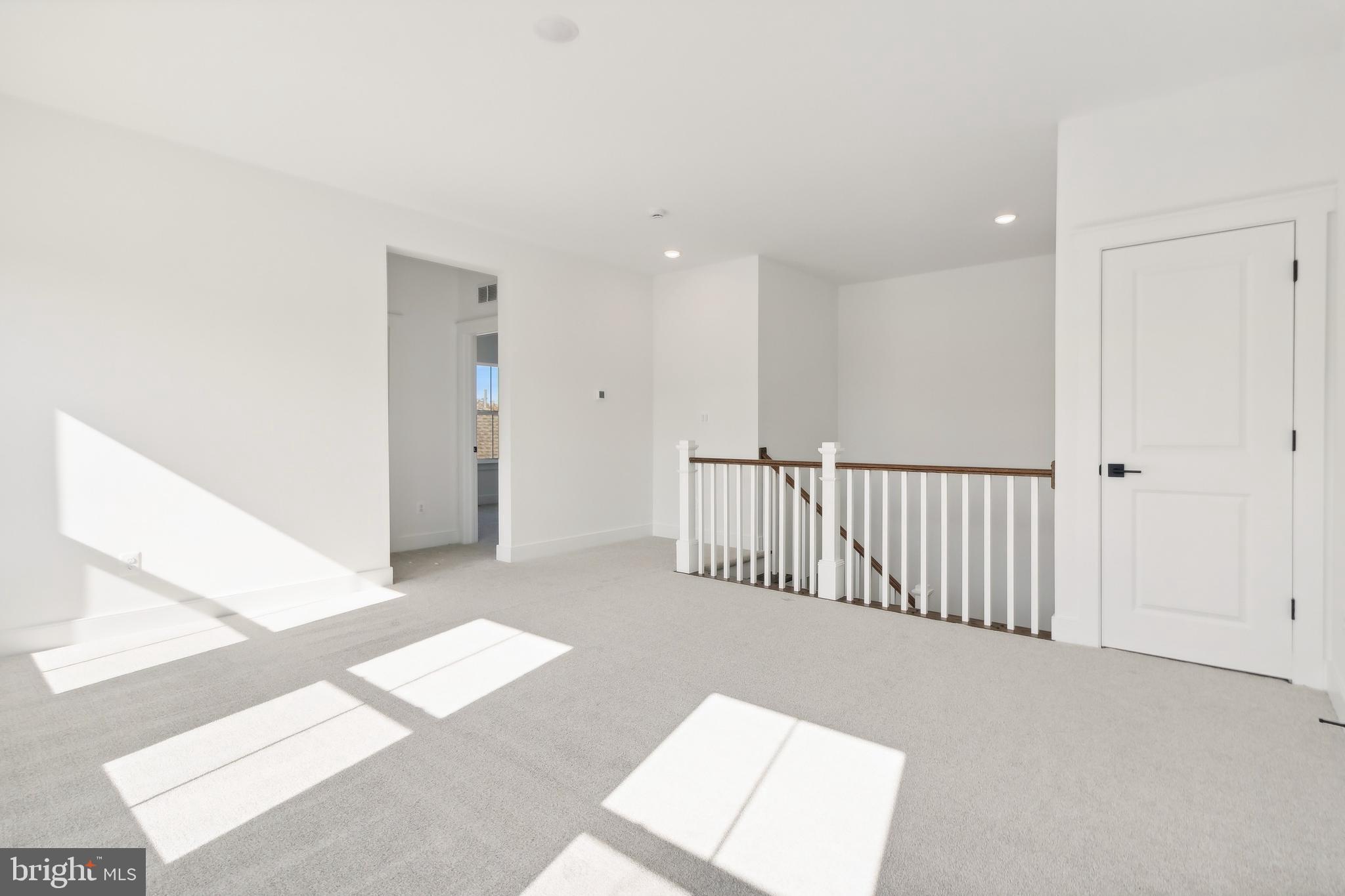 36435 Maple Ridge Lane Georgetown, DE 19947 - Photo 14 of 38 a view of a hallway with windows