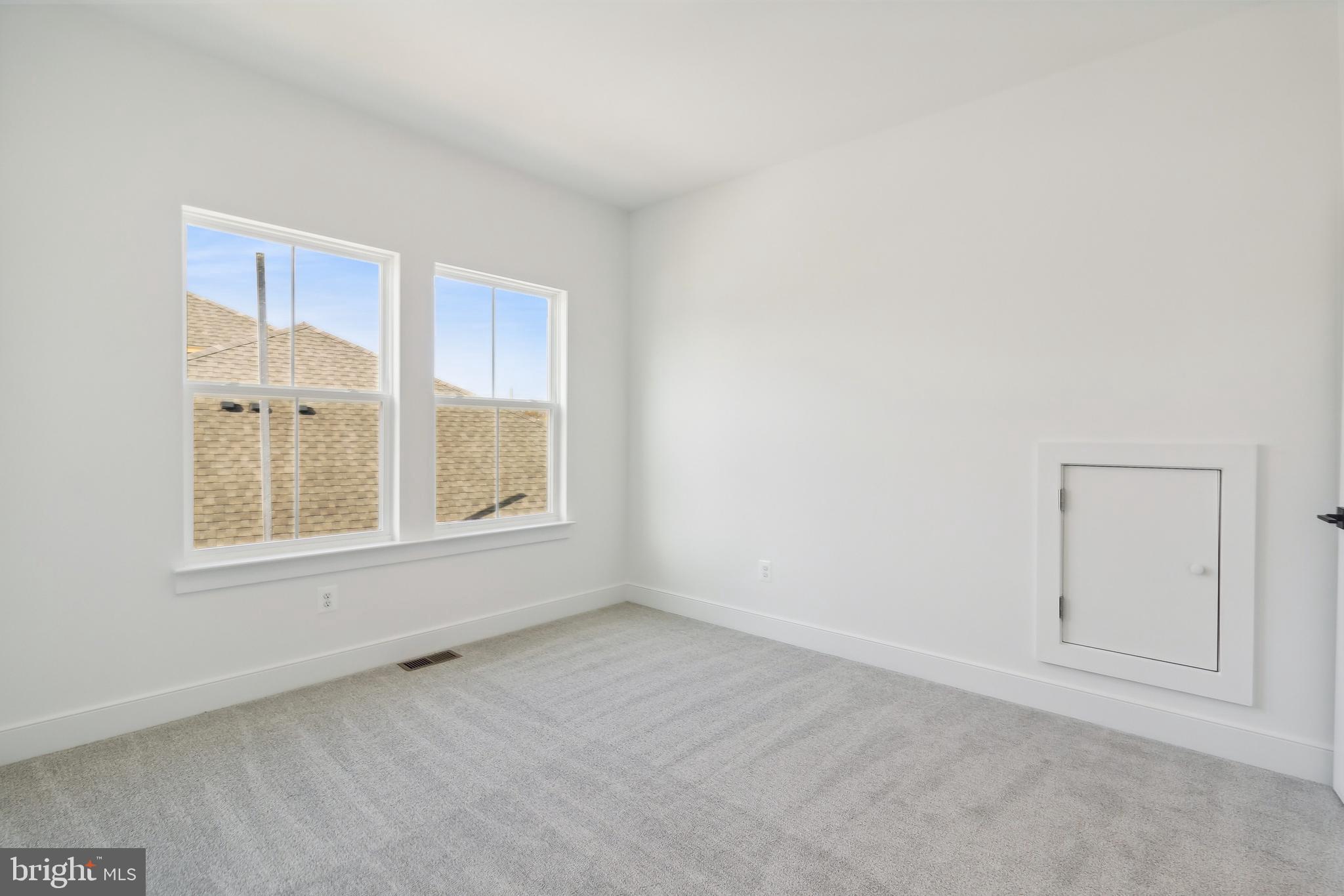 36435 Maple Ridge Lane Georgetown, DE 19947 - Photo 17 of 38 an empty room with windows