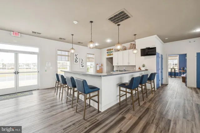 a living room with fireplace furniture and a wooden floor