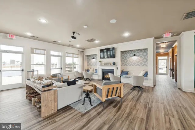 a living room with furniture fireplace and a flat screen tv