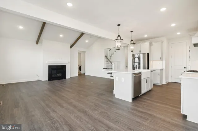 a view of kitchen and sink with wooden floor