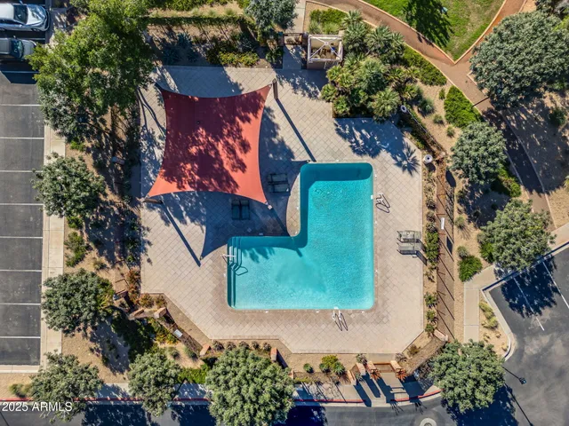 a view of an swimming pool with an outdoor seating and a yard