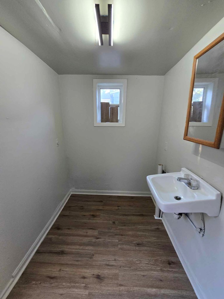 2808 9th Street Columbus, GA 31906 - Photo 4 of 8 a bathroom with a sink and a mirror