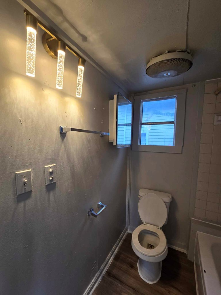 2808 9th Street Columbus, GA 31906 - Photo 7 of 8 a bathroom with a toilet and a sink