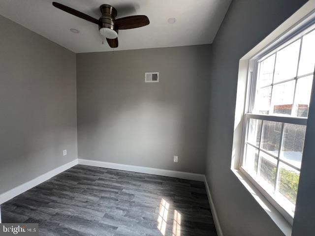 322 East Sterner Street Philadelphia, PA 19134 - Photo 14 of 25 a view of an empty room with wooden floor and a window