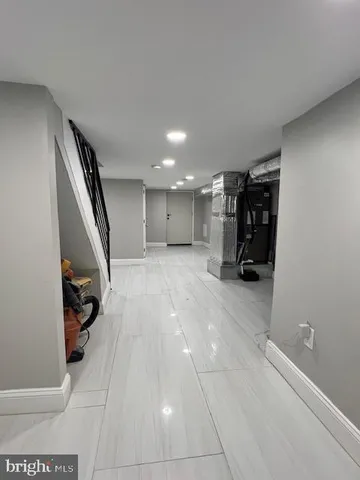 a view of a hallway with stairs