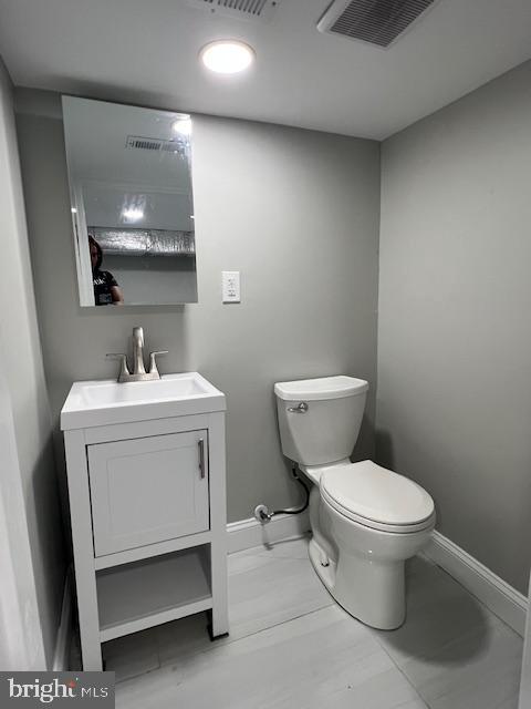 322 East Sterner Street Philadelphia, PA 19134 - Photo 23 of 25 a white toilet sitting next to a bathroom sink