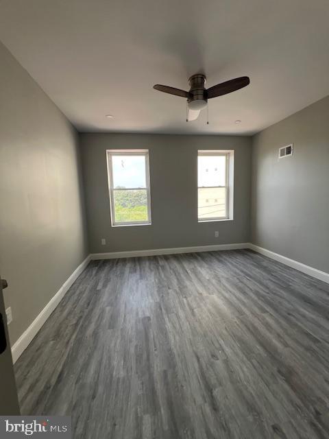 322 East Sterner Street Philadelphia, PA 19134 - Photo 10 of 25 an empty room with wooden floor and windows