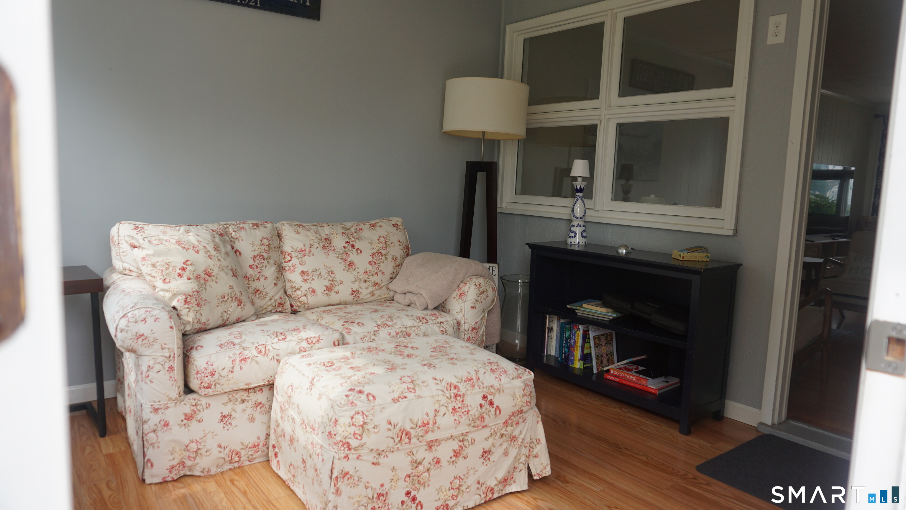13 Pacific Street Groton, CT 06340 - Photo 16 of 31 a living room with a couch and a fireplace
