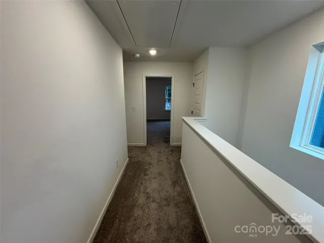 a view of hallway with stairs