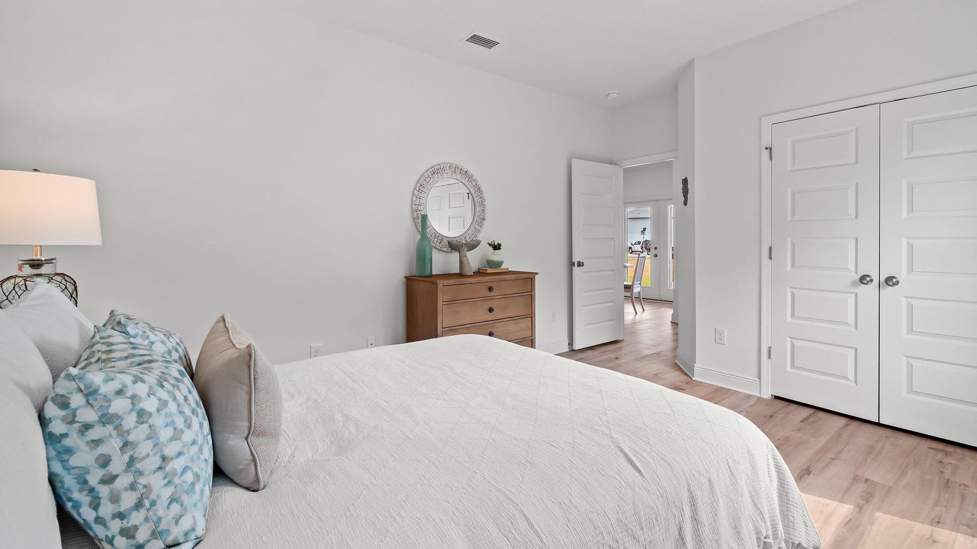 9 Blue Bell Circle Santa Rosa Beach, FL 32459 - Photo 25 of 32 a bedroom with a bed and a chandelier