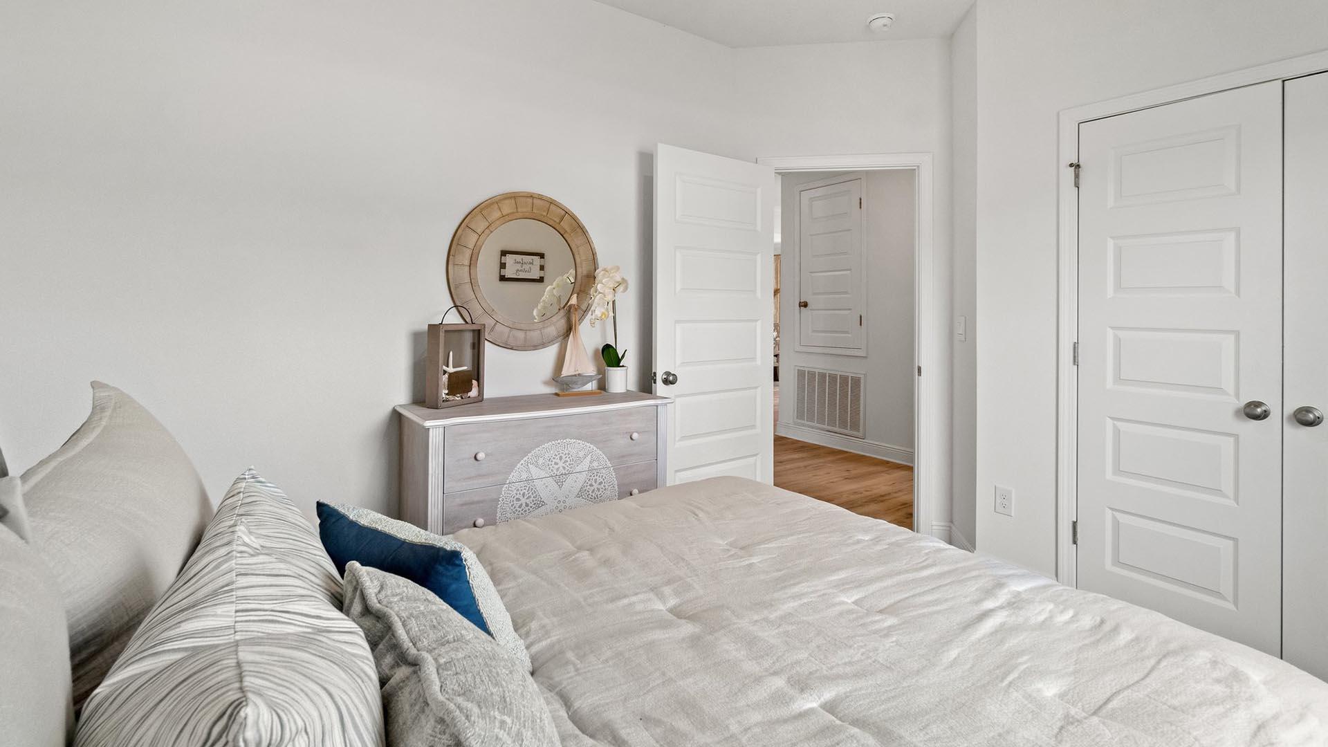 9 Blue Bell Circle Santa Rosa Beach, FL 32459 - Photo 27 of 32 a bedroom with a bed and a chandelier