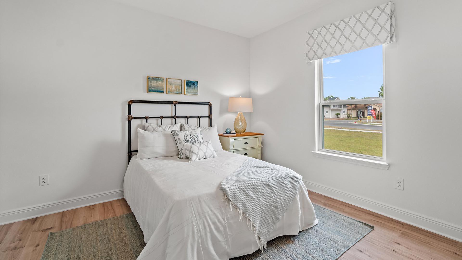 9 Blue Bell Circle Santa Rosa Beach, FL 32459 - Photo 30 of 32 a bedroom with a bed and a painting on the wall