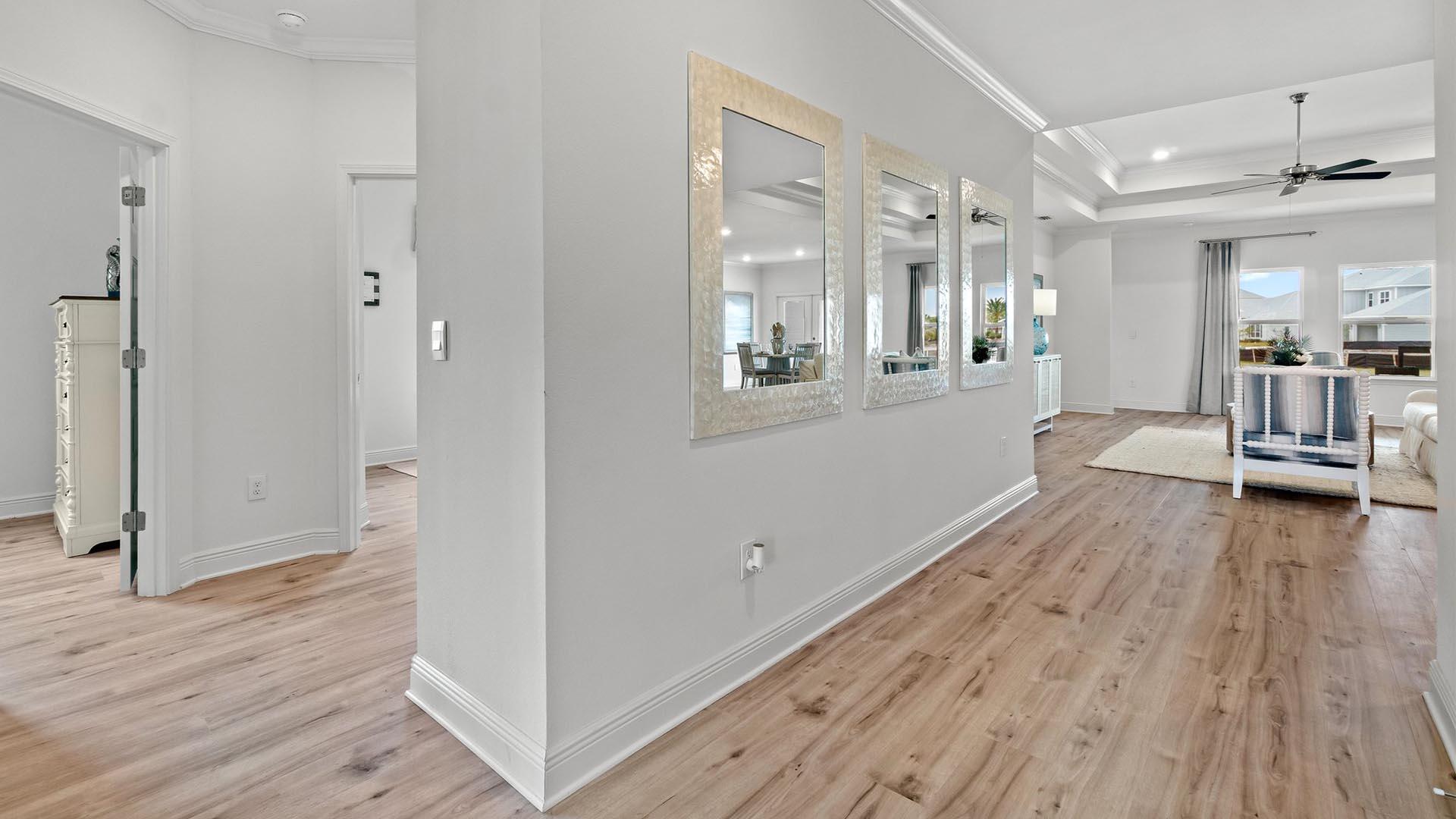 9 Blue Bell Circle Santa Rosa Beach, FL 32459 - Photo 7 of 32 a view of a hallway with wooden floor and chandelier