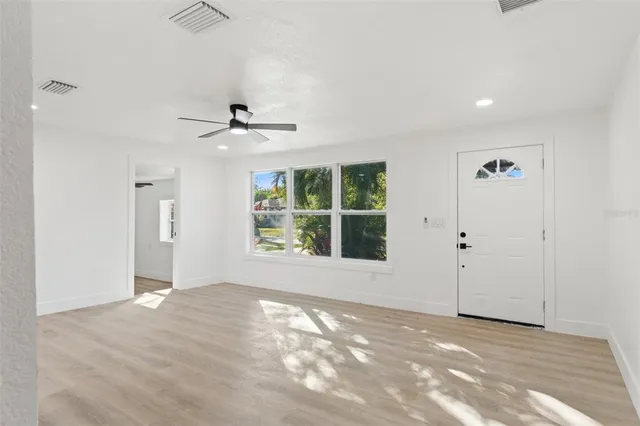 a view of an empty room with a window