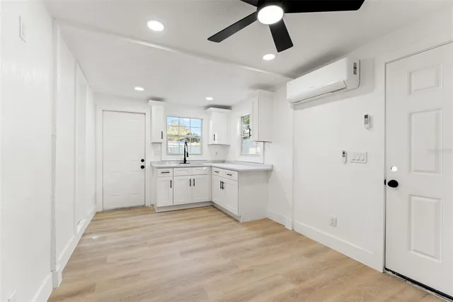 a view of a kitchen with electric appliances