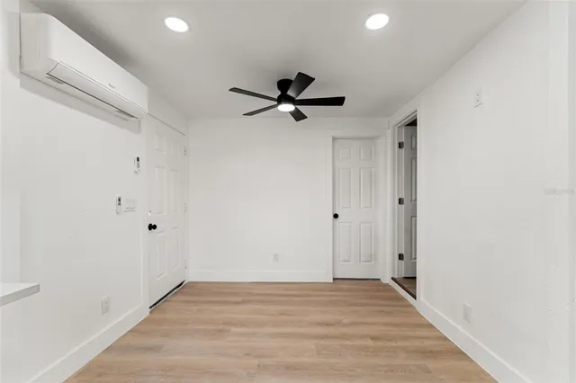 a view of a chandelier fan in a room