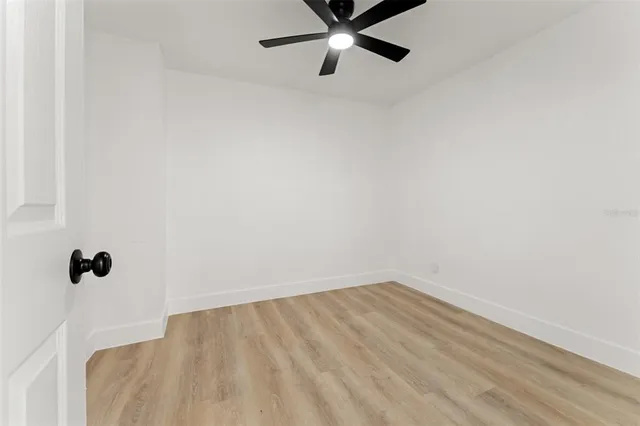 a view of a small space with wooden floor