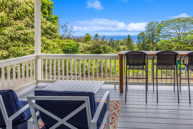 a view of a balcony with chairs
