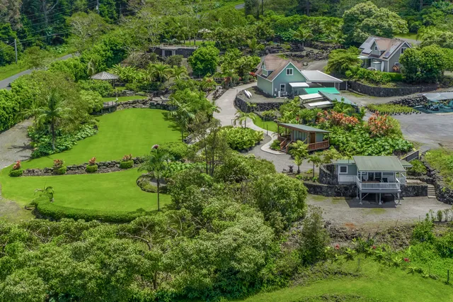 an aerial view of a house with outdoor space and street view
