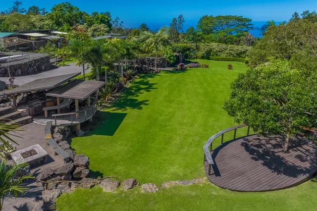 a view of a backyard with a fountain