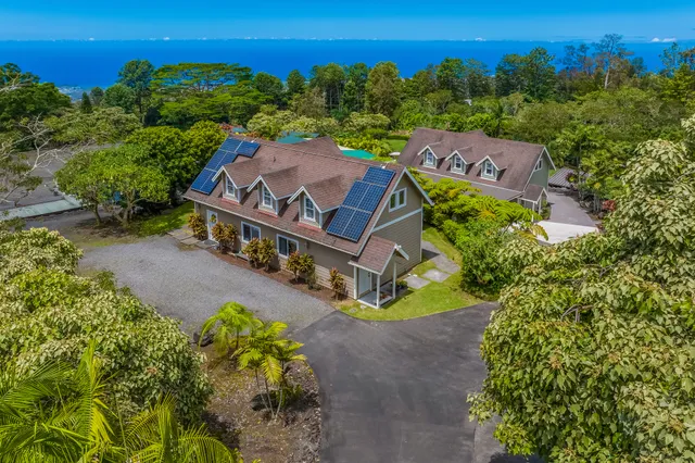 an aerial view of a house with a garden
