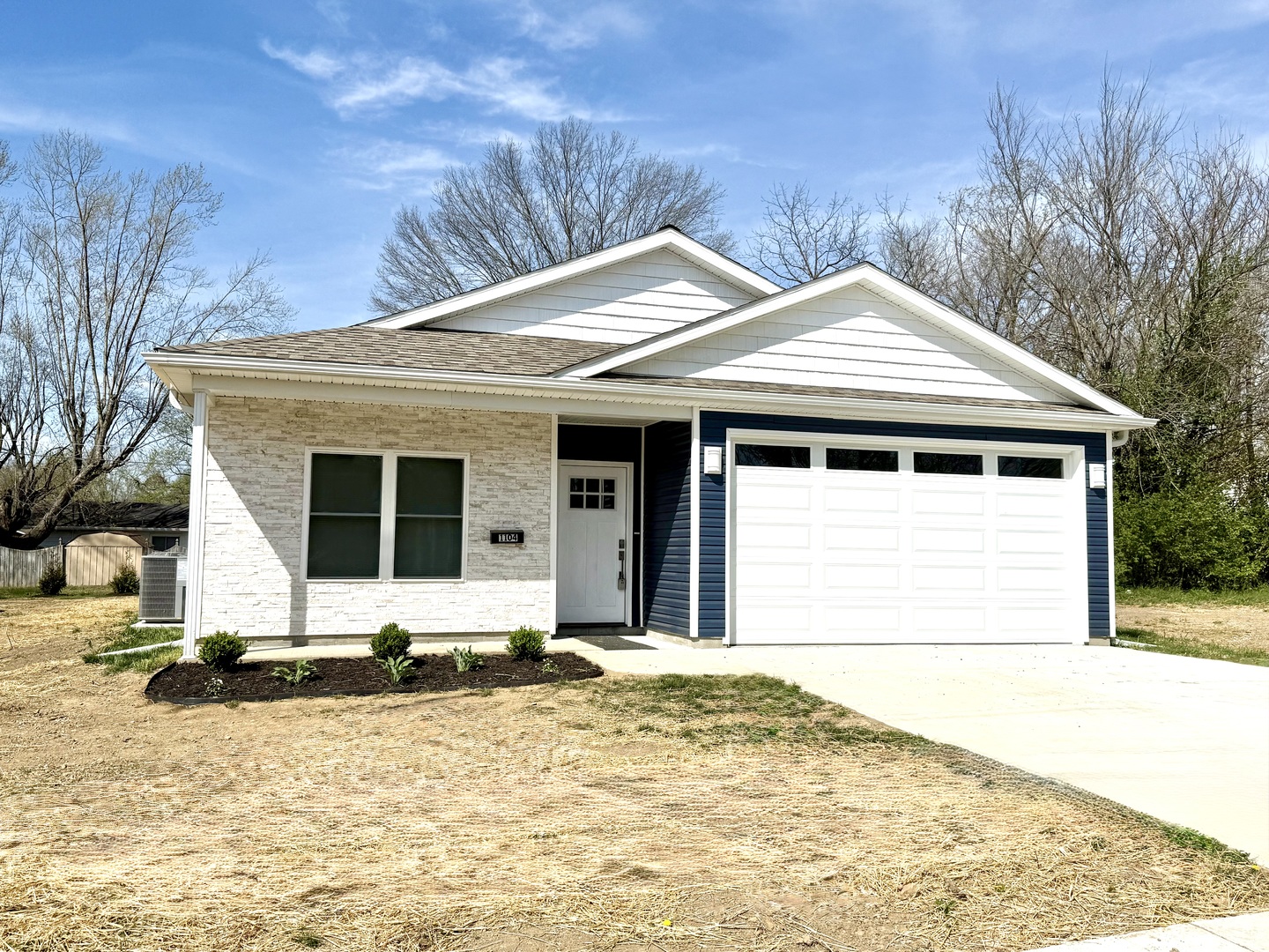 1104 Midway Court Marion, IL 62959 - Photo 1 of 13 a front view of a house with a yard