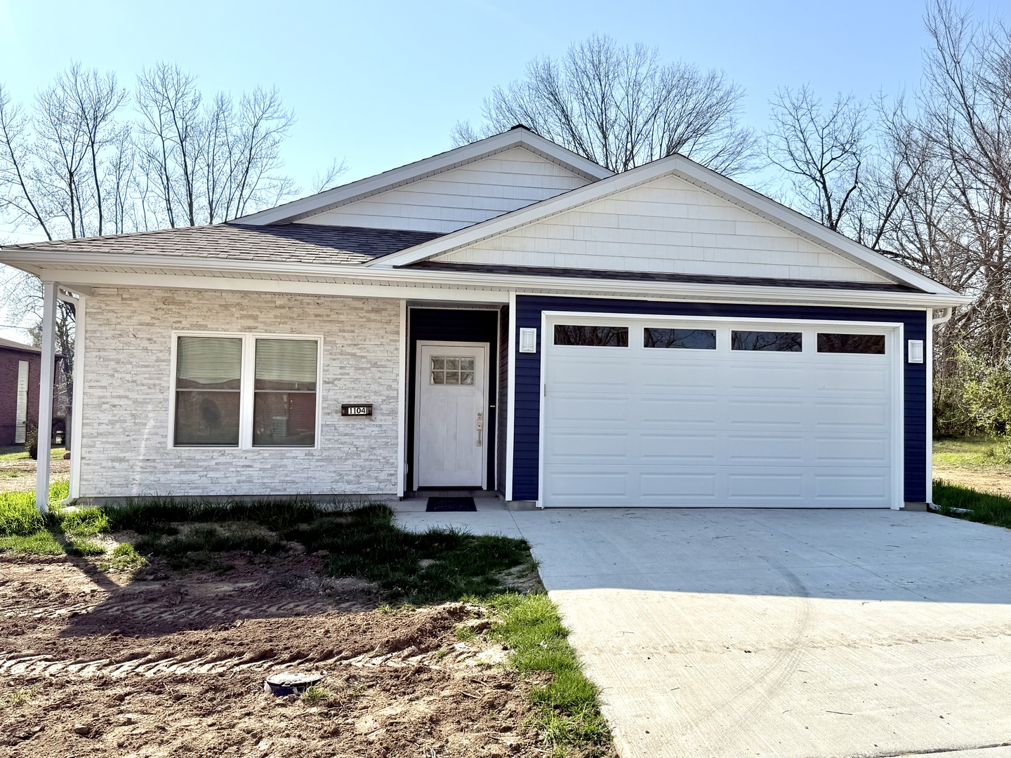 1104 Midway Court Marion, IL 62959 - Photo 13 of 13 a front view of a house with a yard and garage