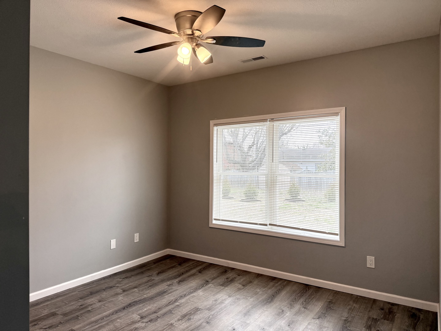 1104 Midway Court Marion, IL 62959 - Photo 5 of 13 an empty room with a window and a fan