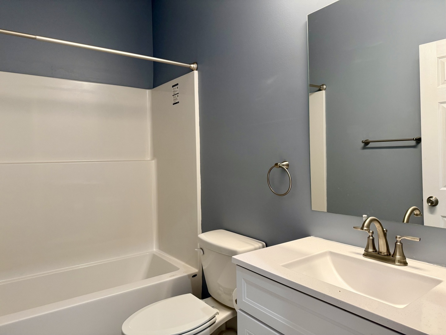 1104 Midway Court Marion, IL 62959 - Photo 10 of 13 a bathroom with a granite countertop bathtub shower sink vanity and toilet