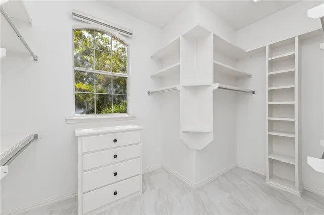 a view of a swimming pool with chairs in patio